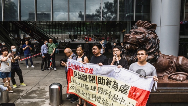 Activists during a protest outside the HSBC headquarters in Hong Kong on June 6. Photographer: Lam Yik/Bloomberg