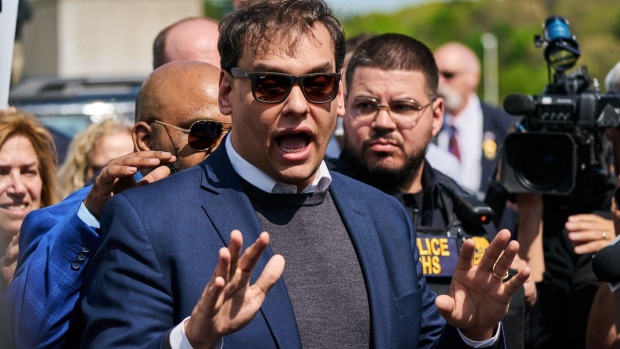 Representative George Santos, a Republican from New York, center, speaks to members of the media outside federal court in Central Islip, New York, US, on Wednesday, May 5, 2023. Santos was arrested and charged by US prosecutors with fraud and money laundering, as the embattled Republican congressman from New York comes under increasing pressure to resign.