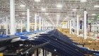 Trays of products move along a conveyor in the packaging area at the MercadoLibre Distribution Center (Cedis) at Prologis Park Grande in Tepotzotlan, Mexico state, Mexico, on Tuesday, Nov. 29, 2022.