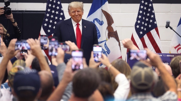 GRIMES, IOWA - JUNE 01: Former President Donald Trump greets supporters at a Team Trump volunteer leadership training event held at the Grimes Community Complex on June 01, 2023 in Grimes, Iowa. Trump delivered an unscripted speech to the crowd at the event before taking several questions from his supporters. (Photo by Scott Olson/Getty Images) Photographer: Scott Olson/Getty Images