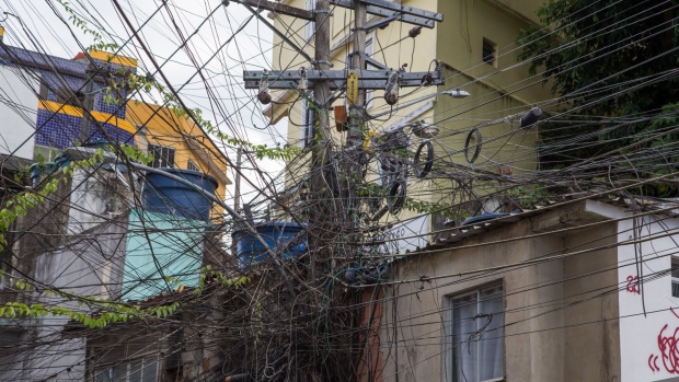 Power lines in a favela in the South Zone of Rio de Janeiro, Brazil, on Thursday, April 27, 2023. The century-old power company Light generates and distributes electricity in Rio and has been struggling with high delinquency rates and power theft in low income neighborhoods, contributing to growth in its total debt to 11.1 billion reais.