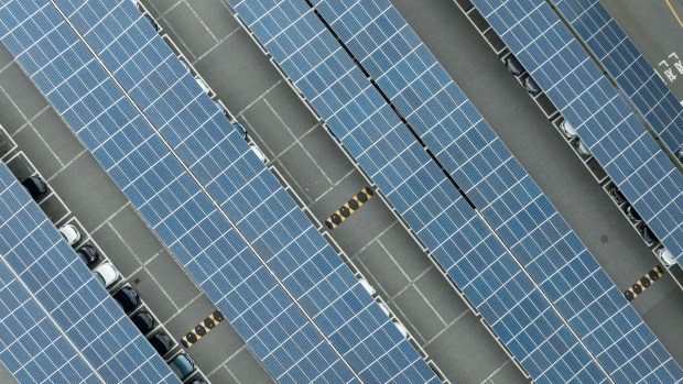 Solar panels on the parking lot at the Hanwha Solutions Corp. Q Cells Division factory in Jincheon, Chungcheongbuk province, South Korea, on Wednesday, Oct. 12, 2022. South Korean clean-energy companies are major foreign winners from Washington’s landmark climate law as they benefit from tax credits and a turn away from China. Hanwha Solutions Corp., a solar equipment maker with manufacturing and research sites in North America, said it’s expecting to get more than $200 million in tax credits annually from next year. Photographer: SeongJoon Cho/Bloomberg