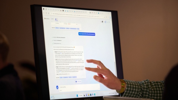 An attendee interacts with the AI-powered Microsoft Bing search engine and Edge browser during an event at the company's headquarters in Redmond, Washington, US, on Tuesday, Feb. 7, 2023. Microsoft unveiled new versions of its Bing internet-search engine and Edge browser powered by the newest technology from ChatGPT maker OpenAI. Photographer: Chona Kasinger/Bloomberg