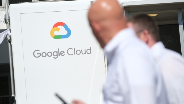 FRANKFURT AM MAIN, GERMANY - SEPTEMBER 11: People walk past a Google Cloud exhibit during the press days at the 2019 IAA Frankfurt Auto Show on September 11, 2019 in Frankfurt am Main, Germany. The IAA will be open to the public from September 12 through 22. (Photo by Sean Gallup/Getty Images)