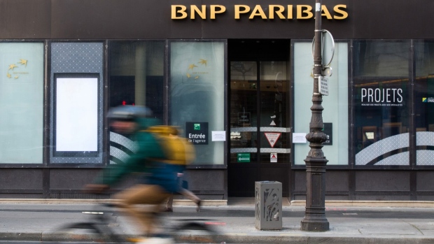 A cyclist passes a BNP Paribas SA bank branch in the Opera district of Paris, France, on Monday, Feb. 6, 2023. BNP Paribas kicks off earnings season for French banks, reporting quarterly numbers Tuesday before the market opens in Paris. Photographer: Nathan Laine/Bloomberg
