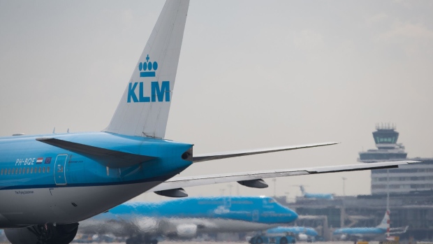 Passenger aircraft operated by KLM, the Dutch arm of Air France-KLM Group, stand on the tarmac at Schiphol airport in Amsterdam, Netherlands, on Tuesday, Aug. 15, 2017. Delta Air Lines Inc., China Eastern Airlines Corp. and Air France-KLM Group are reaching for their checkbooks to forge a deeper global alliance.