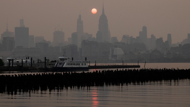 Buildings in the Manhattan skyilne shrouded in smoke from Canada wildfires.