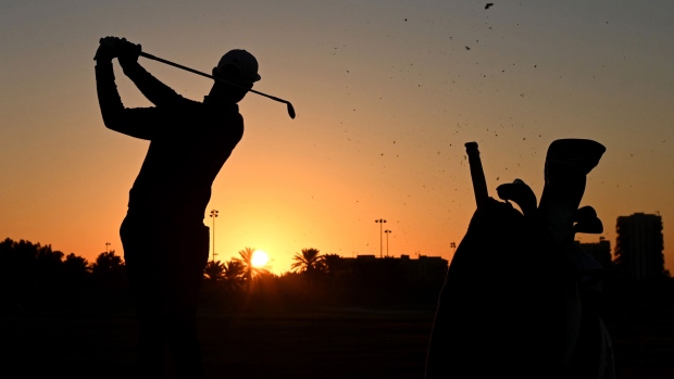 ABU DHABI, UNITED ARAB EMIRATES - JANUARY 17: A silhouette of Erik van Rooyen of South Africa as he warms up on the range ahead of his Round Two match during Day Two of the Abu Dhabi HSBC Championship at Abu Dhabi Golf Club on January 17, 2020 in Abu Dhabi, United Arab Emirates. (Photo by Ross Kinnaird/Getty Images)