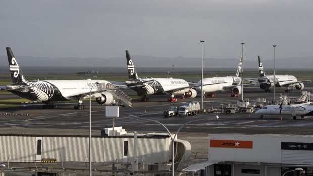 Air New Zealand Ltd. aircraft sit on the tarmac at the International Terminal of Auckland Airport in Auckland, New Zealand, on Tuesday, July 7, 2020. New Zealand’s government will limit the number of citizens flying home with the national airline to reduce pressure on its overflowing quarantine facilities. Photographer: Brendon O'Hagan/Bloomberg