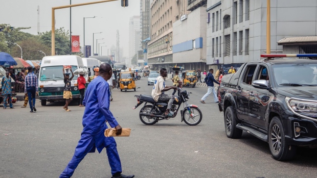 Vehicles travel along Broad Street in Lagos, Nigeria, on Monday, Feb. 20, 2023. Africa's most populous nation heads to the polls on Saturday, and the next president will inherit an economy and country on its knees. Photographer: Benson Ibeabuchi/Bloomberg