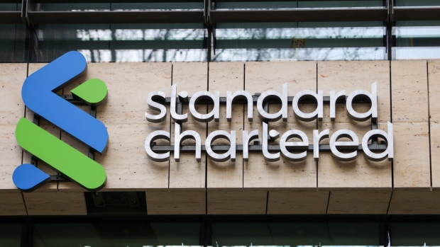 A Standard Chartered Plc logo at their headquarters in London, UK, on Thursday, Feb. 9, Photographer: Hollie Adams/Bloomberg