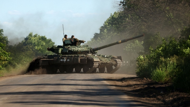 Ukrainian servicemen drive a tank on a road near the front line in the Donetsk region on June 5, 2023, amid the Russian invasion of Ukraine.  Photographer: Anatolii Stepanov/AFP/Getty Images