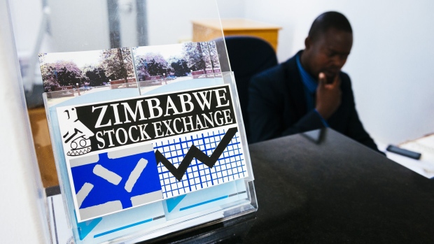 A sign sits on a desk at the Zimbabwe Stock Exchange in Harare, Zimbabwe on Tuesday, July 31, 2018. Zimbabwe’s main opposition party said it was well ahead in the first election of the post-Robert Mugabe era and it’s ready to form the next government, as unofficial results began streaming in. Photographer: Waldo Swiegers/Bloomberg