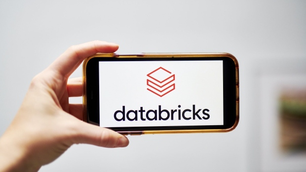 The Databricks Inc. logo on a smartphone arranged in the Brooklyn Borough of New York, U.S., on Monday, Jan. 4, 2021. A booming market for U.S. initial public offerings shows no sign of slowing in 2021. Software maker Databricks Inc. is aiming to go public in the first half of 2021, potentially tapping the same investors who sent Snowflake Inc.’s shares soaring this year. Photographer: Gabby Jones/Bloomberg