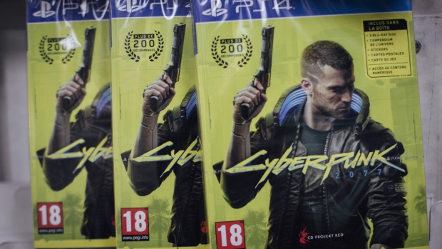 Copies of the Cyberpunk 2077 computer game, produced by CD Projekt SA, for the PlayStation 4 (PS4) console in a video games store in Paris, France, on Thursday, June 17, 2021. The reinstatement of Cyberpunk 2077 to the PlayStation store will help CD Projekt SA with the marketing of games series but may not make much of a difference for its bottom line until a new version of the futuristic role-playing game is ready, according to BOS Bank SA analyst Tomasz Rodak.
