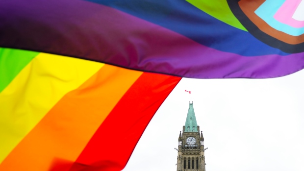 A Pride flag flies on Parliament Hill