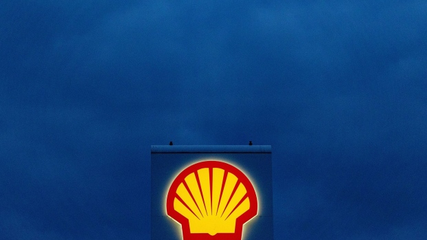 The logo of Shell Plc on a totem sign at a gas station in Schwedt, Germany, on Monday, March 20, 2023. Germany's economy will probably shrink in the first quarter of the year, according to the ZEW institute's gauge of expectations, as concerns over risks in the banking sector add to headwinds from inflation, even as the rate should decline "significantly", the Bundesbank said. Photographer: Krisztian Bocsi/Bloomberg