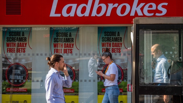 A Ladbrokes betting shop, operated by Entain Plc, in London, U.K., on Wednesday, Sept. 22, 2021. Entain shares jumped after DraftKings Inc. offered to acquire the U.K. gambling company for about $22.4 billion, as a surge in sports betting helps drive deal activity across the industry.