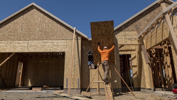 A contractor works on a house under construction at the Toll Brothers Regency at Folsom Ranch community in Folsom, California, US, on Thursday, May 18, 2023. US housing starts increased in April, adding to evidence that residential real estate is gradually recovering after a yearlong slump. Photographer: David Paul Morris/Bloomberg