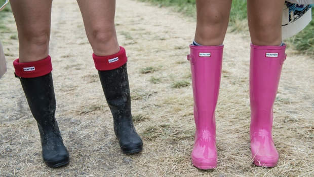 GLASTONBURY, ENGLAND - JUNE 26: Festival-goers wear wellington boots in preparation for rain during the Glastonbury Festival at Worthy Farm on June 26, 2014 in Glastonbury, England. (Photo by Ian Gavan/Getty Images)