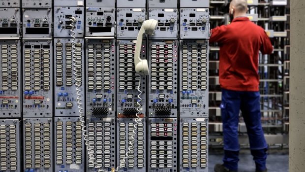A technician performs checks in a Telecom Italia SpA telephone exchange in Rome, Italy, on Tuesday, April 4, 2023. Telecom Italia sold €400 million ($435 million) of bonds as it pushes ahead with the sale of its landline network in a bid to slash the company’s debt pile after interest rates rose.