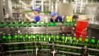 Carlsberg beer bottles move along the production line at a brewery in Russia. Photographer: Andrey Rudakov/Bloomberg