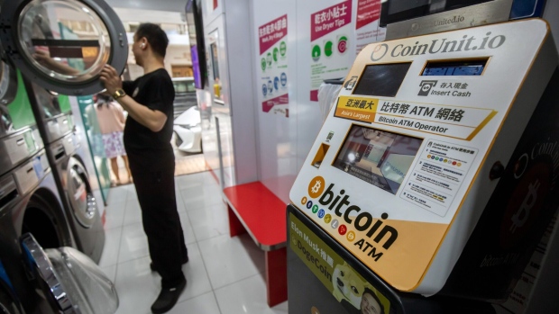 A cryptocurrency ATM, operated by Coinunit.io, at a laundromat in Hong Kong, China, on Wednesday, May 24, 2023. Hong Kong, which is preparing to introduce a new regime for trading digital assets, is responding to concerns raised by industry players about the shortage of a crucial type of worker. Photographer: Paul Yeung/Bloomberg
