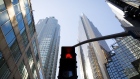 A crosswalk sign flashes red in the financial district of Toronto, Ontario, Canada, on Friday, May 22, 2020. Whether the PATH, a subterranean network that provides connections between major commuter stations, over 80 properties, including the headquarters of Canada's five largest banks, and 1,200 retail spots, can return to its glory days will depend initially on how quickly Bay St. firms return workers to their offices. Photographer: Cole Burston/Bloomberg