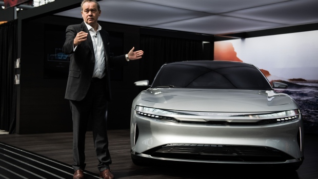 Lucid CEO Peter Rawlinson with a Lucid Air prototype.
