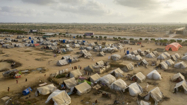 The refugee camp outside Karachi in May. “The already difficult living conditions of people affected by the 2022 flooding in Pakistan have been further exacerbated by the rain, making them even more vulnerable to future flooding,” the UN noted in a recent report.  Photographer: Asim Hafeez/Bloomberg