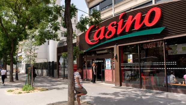 Pedestrians outside a Casino supermarket, operated by Casino Guichard-Perrachon SA, in Paris, France, on Tuesday, June 27, 2023. Casino said it will need an equity boost of €900 million ($981 million) or more and the conversion of its unsecured debt into stock as the French retailer hammers out a restructuring plan. Photographer: Benjamin Girette/Bloomberg