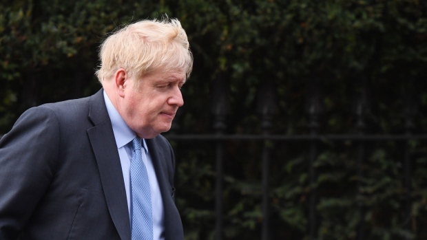 Boris Johnson, former UK prime minister, departs from his home in London, UK, on Wednesday, March 22, 2023. Johnson — the man who became prime minister thanks to Brexit — will seek to save his reputation by giving evidence to a committee investigating whether he deliberately lied to lawmakers over “Partygate,” a series of lockdown-busting gatherings held in Downing Street during the pandemic. Photographer: Chris J. Ratcliffe/Bloomberg