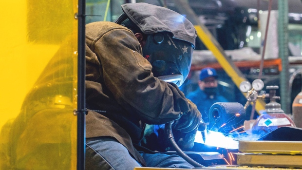 An employee welds during production at the BYD Coach and Bus manufacturing facility in Lancaster, California, US, on Thursday, Feb. 2, 2023. BYD Co., China's homegrown company that's now become the world's hottest maker of electric vehicles, has a warning for the US: New climate laws could end up backfiring and leave Americans paying more for EVs than the rest of the world.
