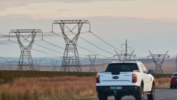 High voltage electricity transmission towers in Mpumalanga, South Africa, on Friday, May 5, 2023. Debt-strapped Eskom is currently implementing daily blackouts because its dilapidated power plants are unable to supply enough electricity to meet demand and it doesn’t have the money to invest in capital equipment.