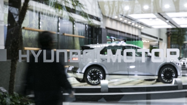 Signage outside the lobby of the Hyundai Motor Co. headquarters building in Seoul, South Korea, on Thursday, Dec. 15, 2022. Hyundai, now the world’s third-largest carmaker behind Toyota Motor Corp. and Volkswagen AG, is duking it out with Ford Motor Co. for second place in US electric vehicle sales this year, behind Tesla Inc.