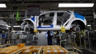 An employee works on the production line manufacturing Hyundai Motor Co. Ioniq 5 electric vehicles at the company's plant in Ulsan, South Korea, on Thursday, Jan. 20, 2022. The last time Hyundai Motor sold a car in Japan was in 2009, when it pulled out after years of dismal sales. Now, South Korea’s top automaker is back, but with a twist: it’s only going to sell electric vehicles, and only online. Photographer: SeongJoon Cho/Bloomberg