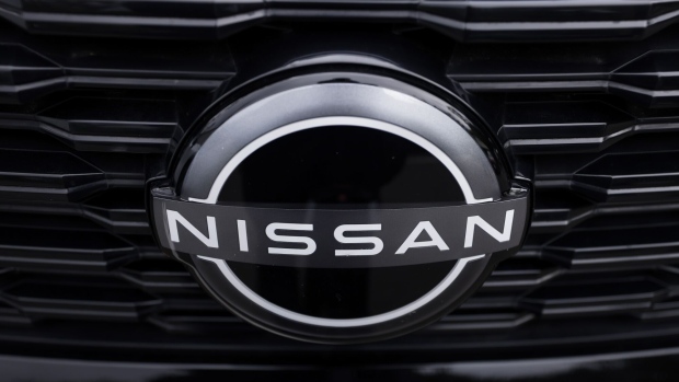 A Nissan Motor Co. badge on an X-Trail sport utility vehicle (SUV) during a test driving event in Tokyo, Japan, on Monday, April 17, 2023. Renault SA is set to cut its holding in Nissan to 15% from 43%, while Nissan intends to take a stake of as much as 15% in Renault’s EV business, Ampere. Photographer: Kiyoshi Ota/Bloomberg