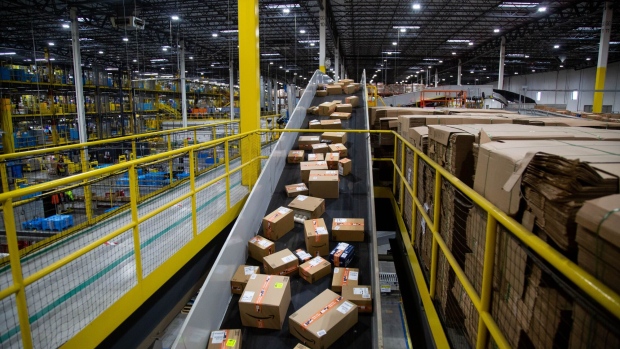 Packages move along a conveyor at an Amazon fulfillment center in Robbinsville, New Jersey, US.