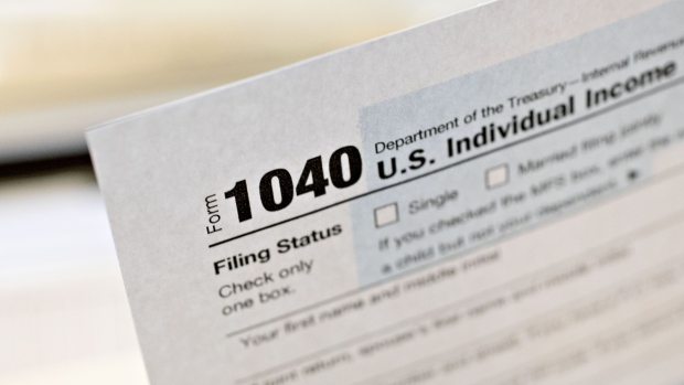 A U.S. Department of the Treasury Internal Revenue Service (IRS) 1040 Individual Income Tax form for the 2019 tax year is arranged for a photograph in Tiskilwa, Illinois, U.S., on Friday, March 20, 2020. Tax forms and payments wont be due to the Internal Revenue Service until July 15 this year, Treasury Secretary Steven Mnuchin said in a tweet, as the government looks for ways to respond to the coronavirus. Photographer: Daniel Acker/Bloomberg