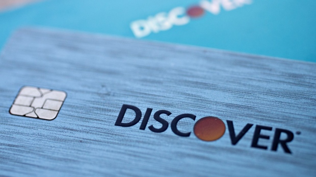Discover Financial Services chip credit and debit cards are arranged for a photograph in Washington, D.C., U.S., on Friday, Oct. 20, 2017. Discover Financial Services is scheduled to release earning figures on October 24.