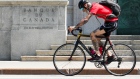 Cyclist passing the Bank of Canada