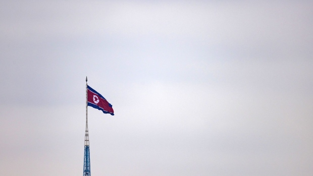 A North Korean flag flies above North Korea's Gijungdong village, from the truce village of Panmunjom in the Demilitarized Zone (DMZ) in Paju, South Korea, on Friday, March 3, 2023. The US and South Korea plan to hold large-scale military drills in a move set anger Pyongyang, which has promised an unprecedented response to the exercises and threatened to turn the Pacific Ocean into its "firing range." Photographer: SeongJoon Cho/Bloomberg