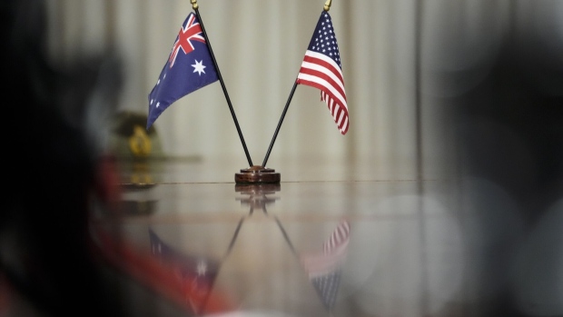 ARLINGTON, VA - SEPTEMBER 22: Australian and American flags sit on the table during a meeting between Prime Minister of Australia Scott Morrison and U.S. Secretary of Defense Lloyd Austin at the Pentagon on September 22, 2021 in Arlington, Virginia. Last week, Australia, the United States and the United Kingdom announced a security pact (AUKUS) to help Australia develop and deploy nuclear-powered submarines, in addition to other military cooperation. (Photo by Drew Angerer/Getty Images)