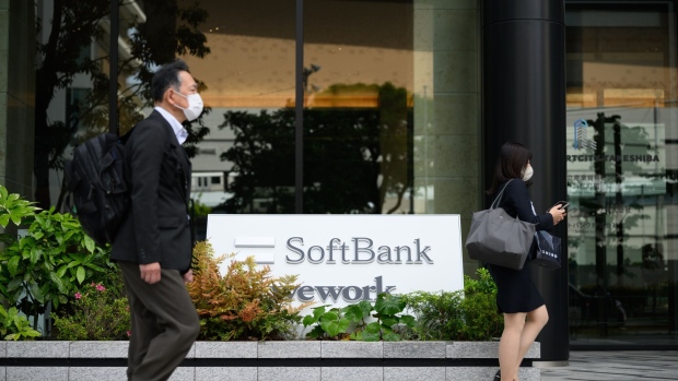The SoftBank logo outside the Tokyo Portcity Takeshiba building, which houses the company's headquarters, in Tokyo, Japan, on Tuesday, May 9, 2023. SoftBank Group is scheduled to release earnings figures on May 11. Photographer: Akio Kon/Bloomberg