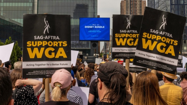 Writers Guild of America members and supporters on a picket line outside the Disney Upfront presentation in New York, US, on Tuesday, May 16, 2023. Writers for some of the most popular shows on television are walking off the job, striking for higher pay amid rapid changes in the way people watch their programs and films. Photographer: Alex Kent/Bloomberg