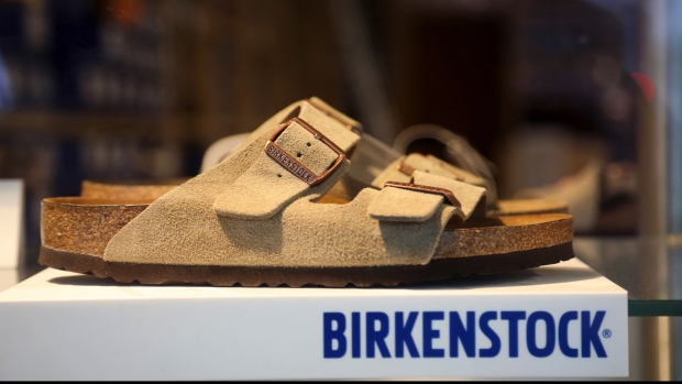 A sandal in the window display of a Birkenstock GmbH footwear store in Berlin, Germany, on Tuesday, Jan. 19, 2021. Birkenstock, the German company behind the iconic sandals worn by hippies and preppies alike, is in talks to be taken over by CVC Capital Partners, according to people familiar with the matter. Photographer: Liesa Johannssen-Koppitz/Bloomberg