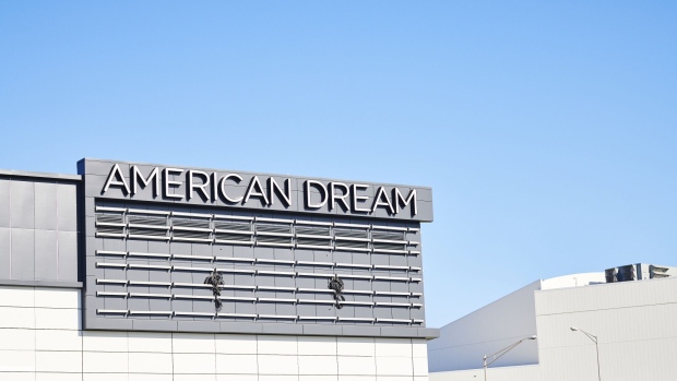 Signage stands outside the American Dream complex in East Rutherford, New Jersey, U.S., on Thursday, Aug. 29, 2019. After 16 years of false starts, the behemoth American Dream retail and amusement complex is set to open just west of Manhattan. To get there, an expected 40 million visitors must join the traffic-choked roads of northern New Jersey.