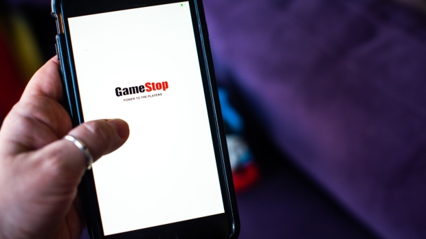 The GameStop Corp. app on a smartphone arranged in Hastings-On-Hudson, New York, U.S., on Friday, Jan. 29, 2021. GameStop Corp. advanced on Friday and was on track to recoup much of Thursday’s $11 billion blow after Robinhood Markets Inc. and other brokerages eased trading restrictions on the video-game retailer. Photographer: Tiffany Hagler-Geard/Bloomberg