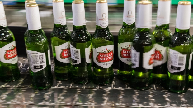 Bottles of Stella Artois lager beer pass along a conveyor at the Anheuser-Busch InBev NV brewery in Leuven, Belgium, on Wednesday, July 17, 2019. The world’s largest brewer reports half year earnings on July 24.