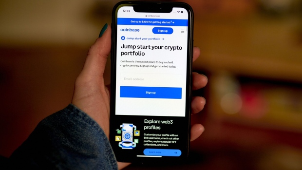 The Coinbase website on a smartphone arranged in the Brooklyn borough of New York, US, on Wednesday, June 7, 2023. The list of digital tokens deemed as unregistered securities by the Securities and Exchange Commission now spans over $120 billion of crypto after the US agencys lawsuits against Binance Holdings Ltd. and Coinbase Global Inc.